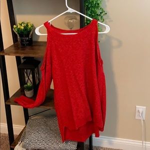Red sweater with peephole sleeves